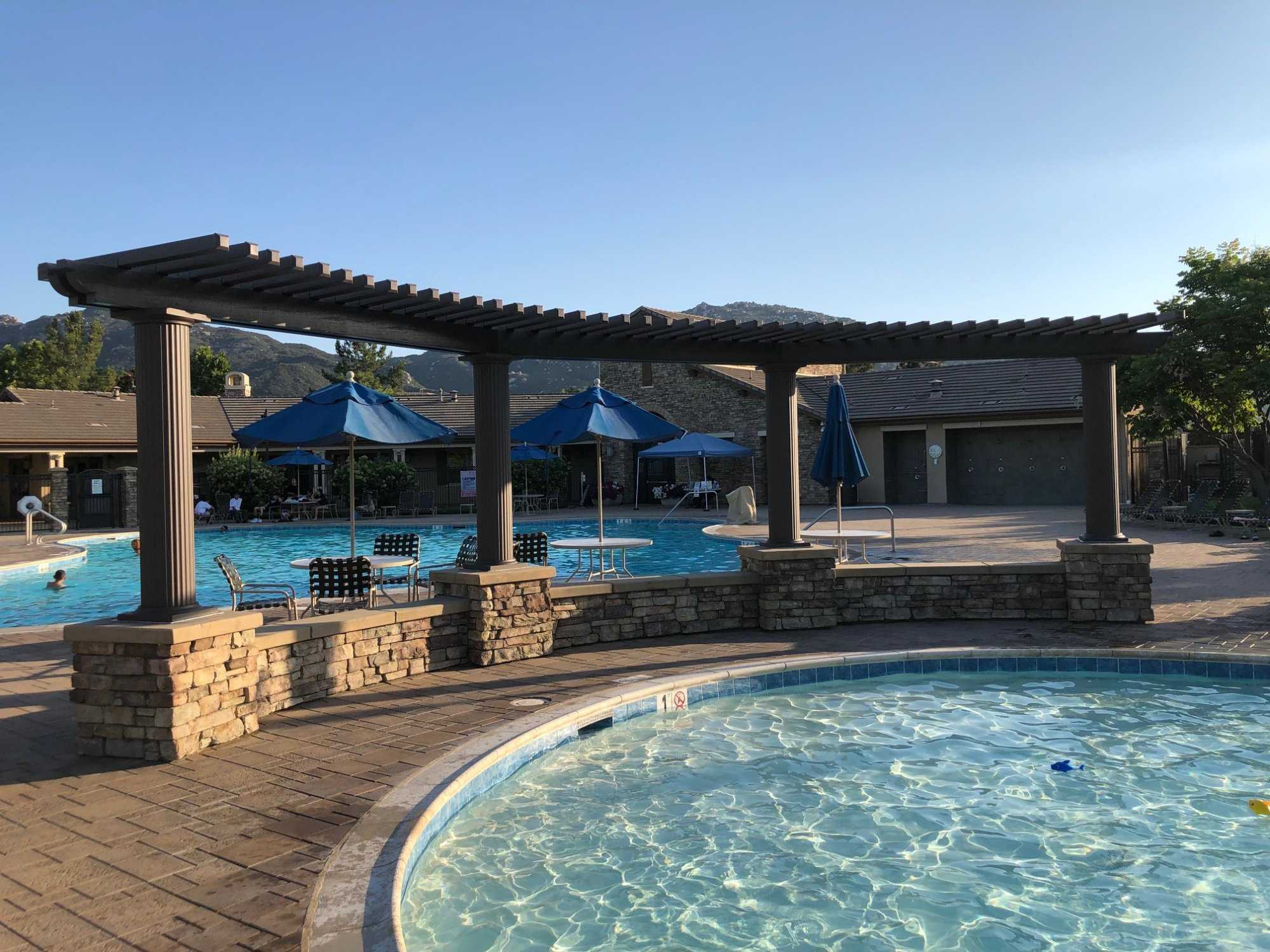 Resort-scale pergola with mountain backdrop